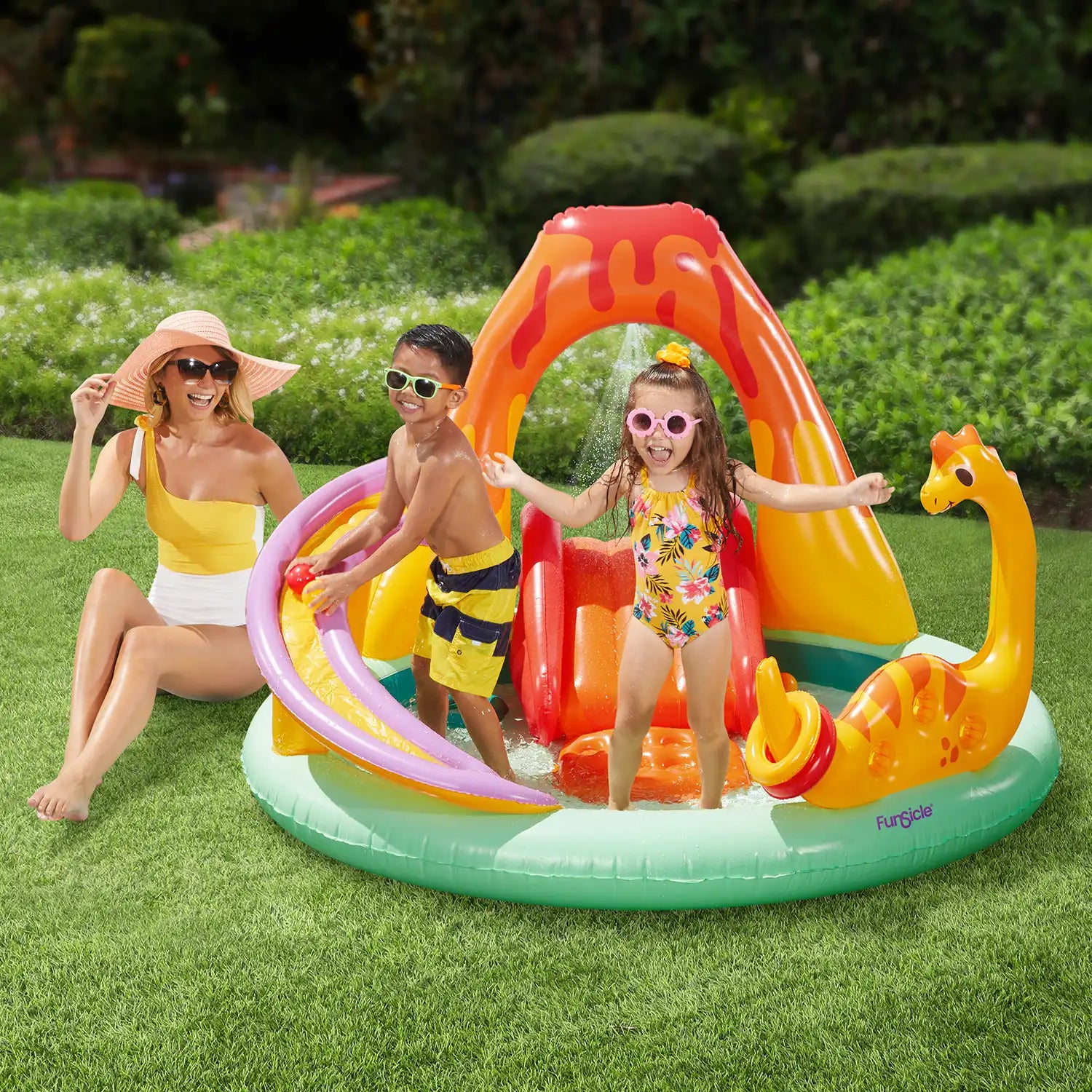 models with Funsicle Volcanic Valley Playcenter in a garden
