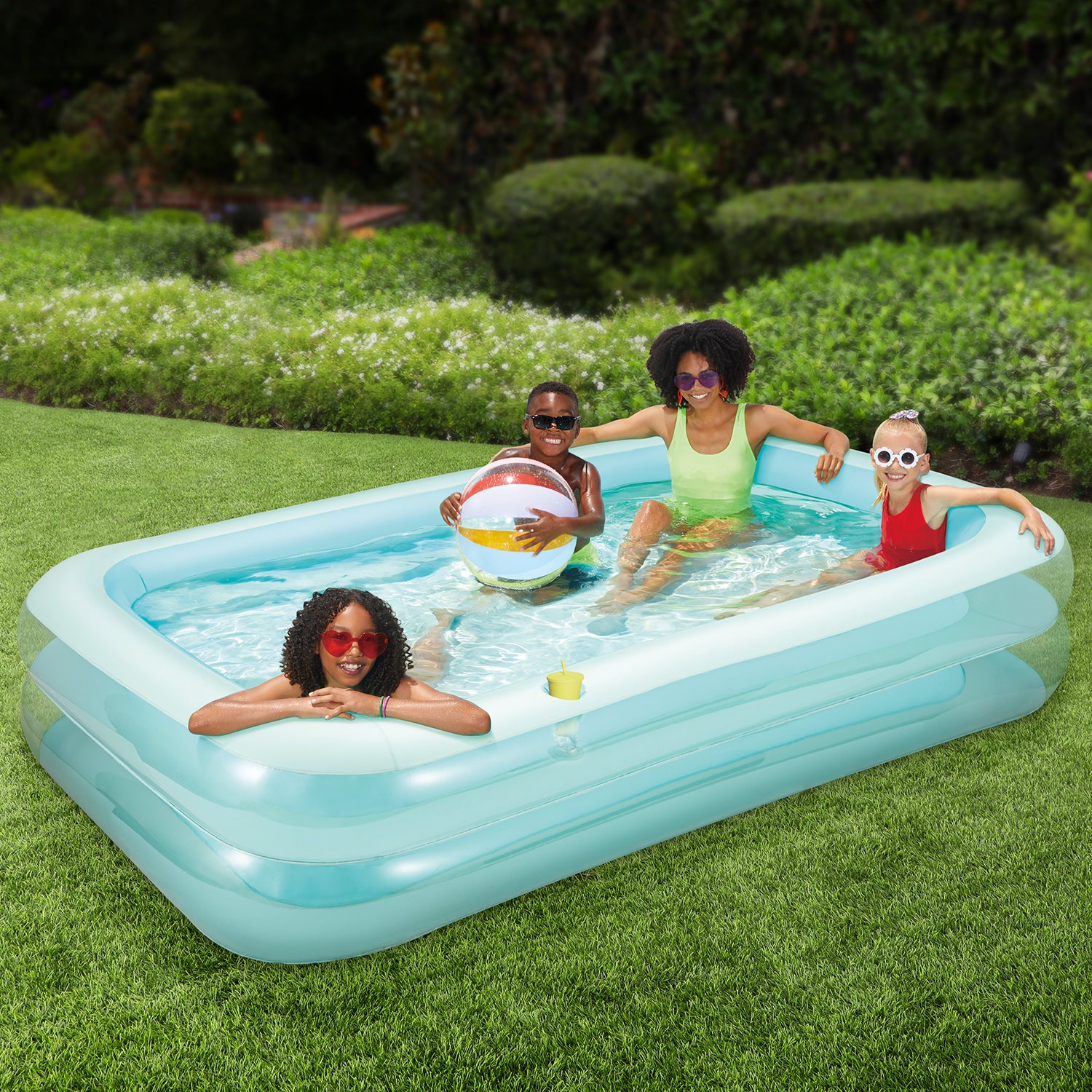 Funsicle SummerBlock Pool with models on a grass background