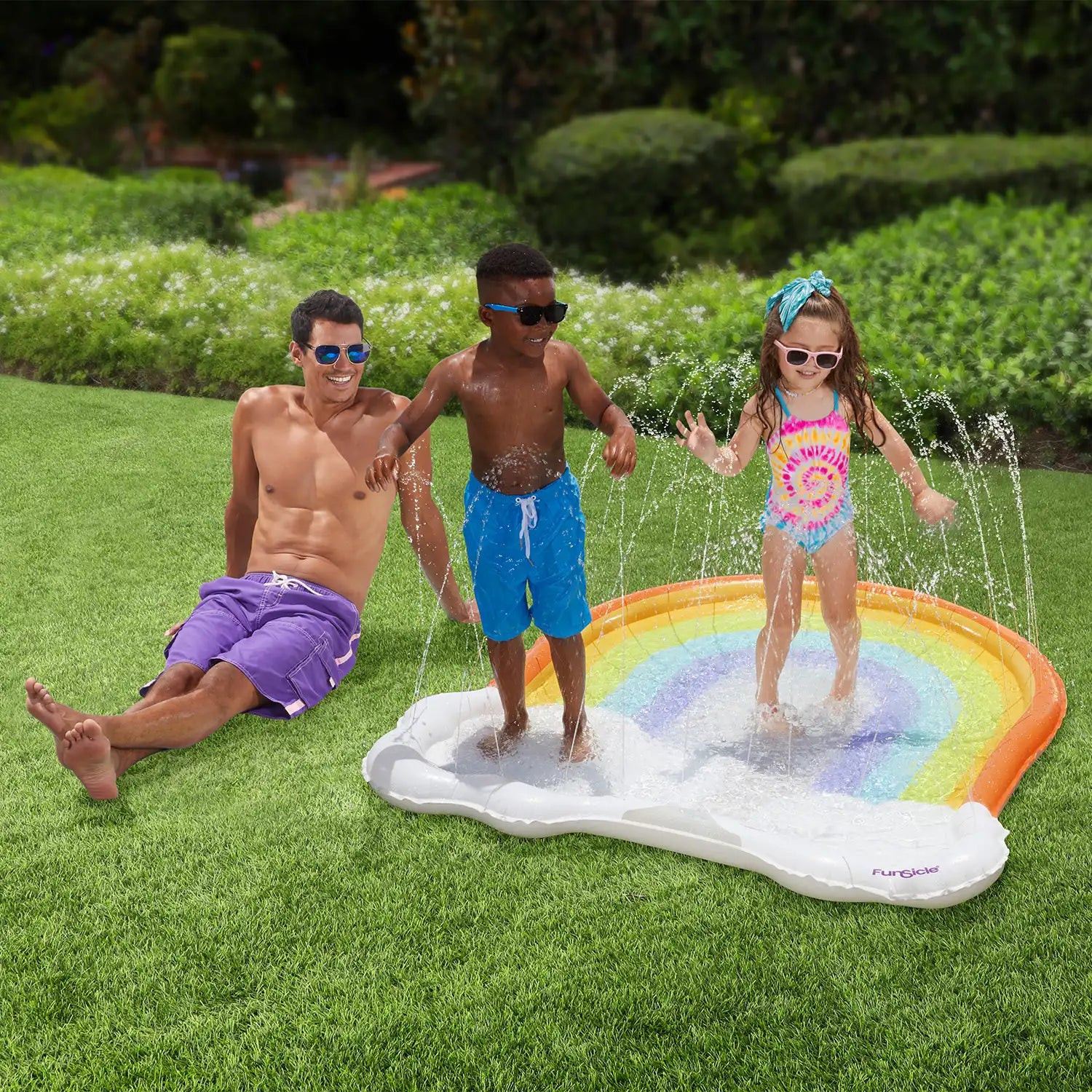 models with Funsicle Rainbow FunSpray Splash Mat in a garden