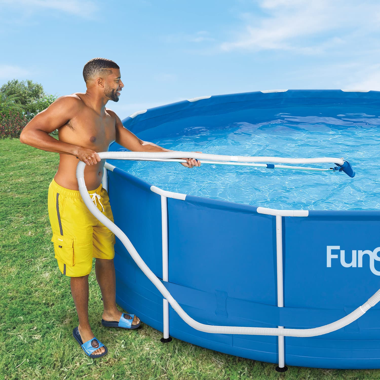 a model using Funsicle Deluxe Maintenance Kit to clean Funsicle Activity Pool
