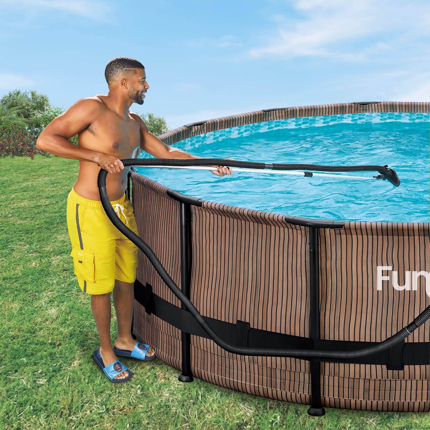 a model using Funsicle Deluxe Maintenance Kit to clean Funsicle Oasis Designer Pool