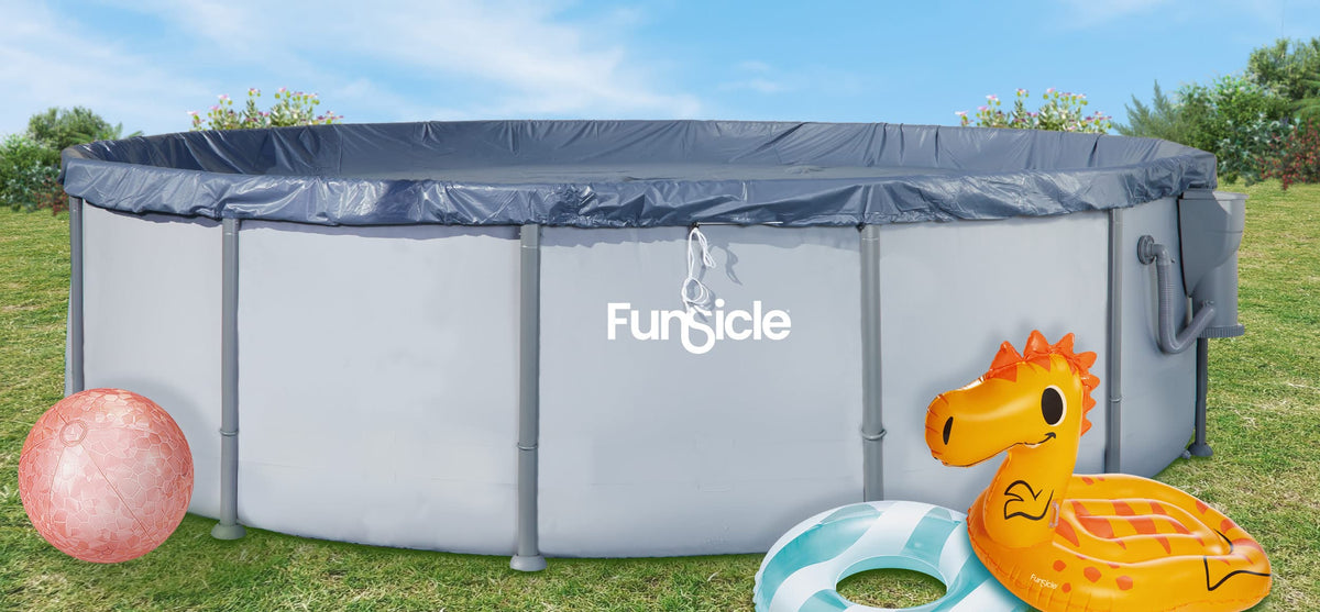 Funsicle pool with cover and inflatables around it on a grass background