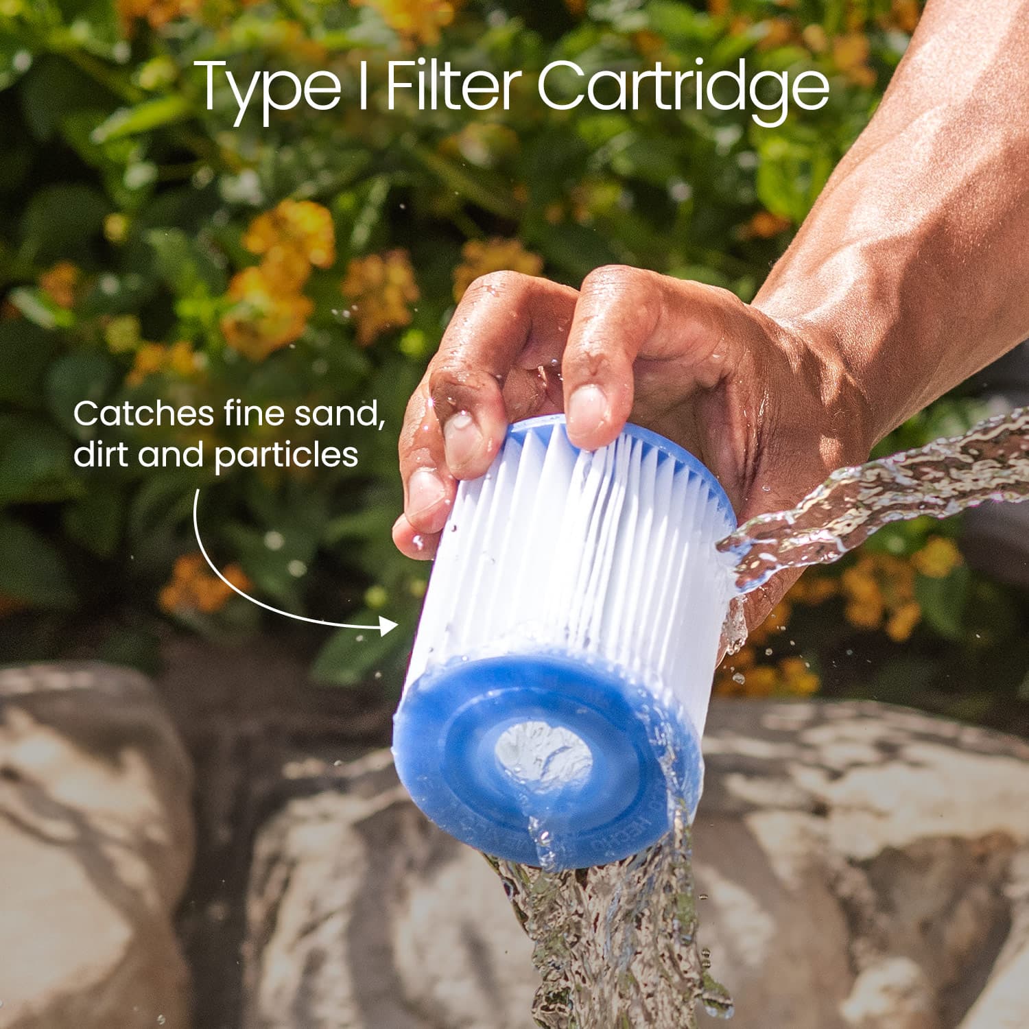 Hand holding a filter cartridge with water flowing, set against a natural background.