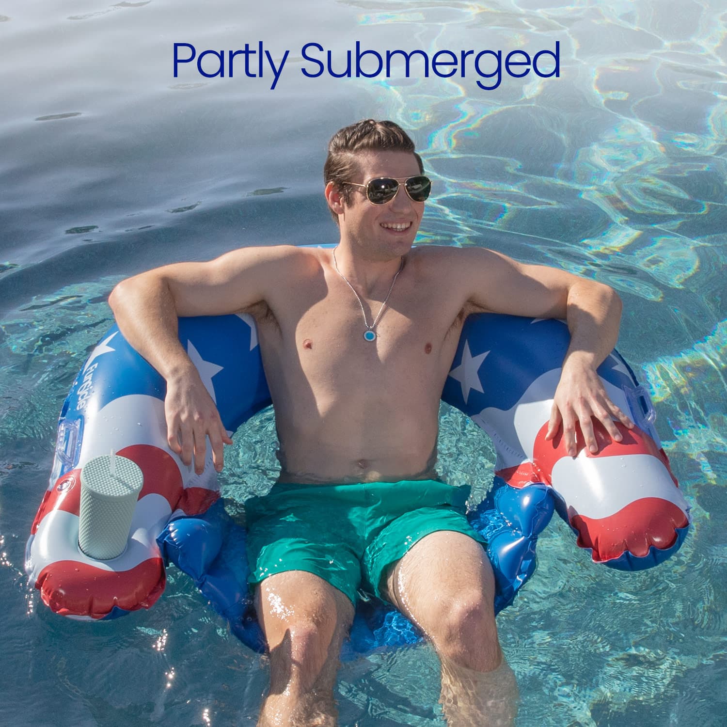 Man lounging on a patriotic inflatable ring in a pool with 'Partly Submerged' text above.