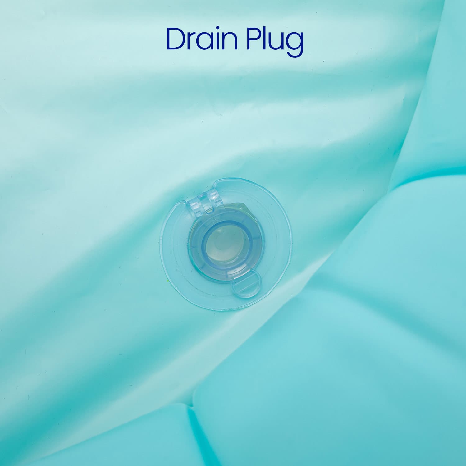 Clear drain plug on a light blue inflatable surface with 'Drain Plug' text.