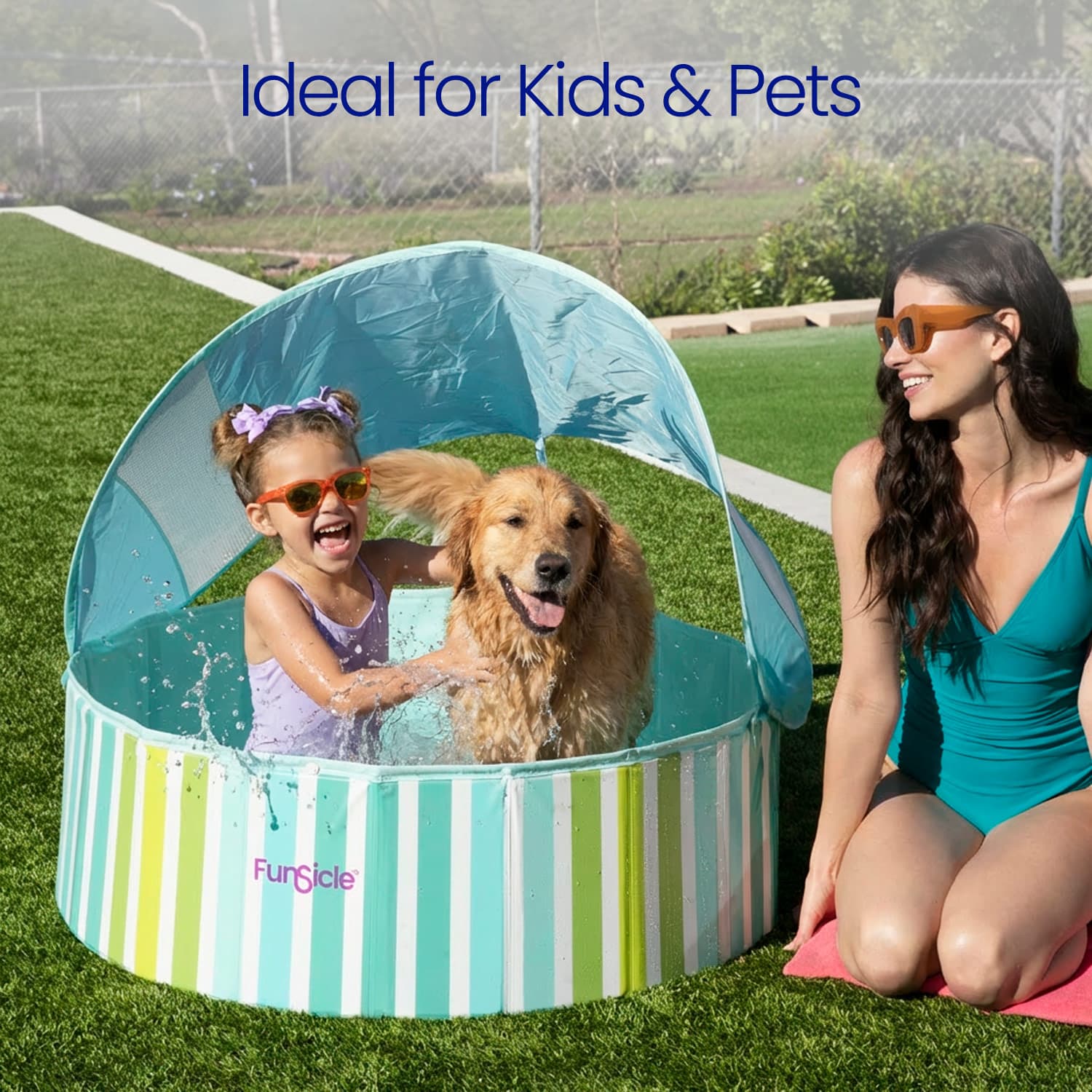 Children playing with a dog in a striped pool with a canopy, ideal for kids and pets.