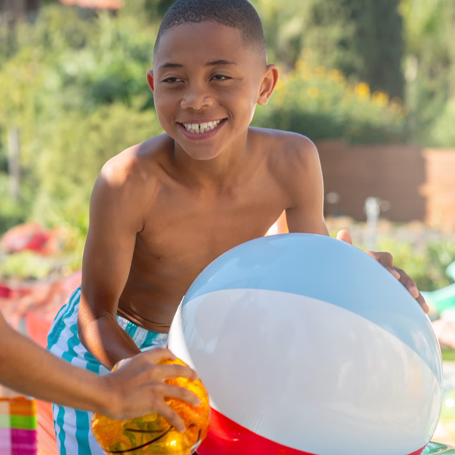 Funsicle FunBall with a model in backyard