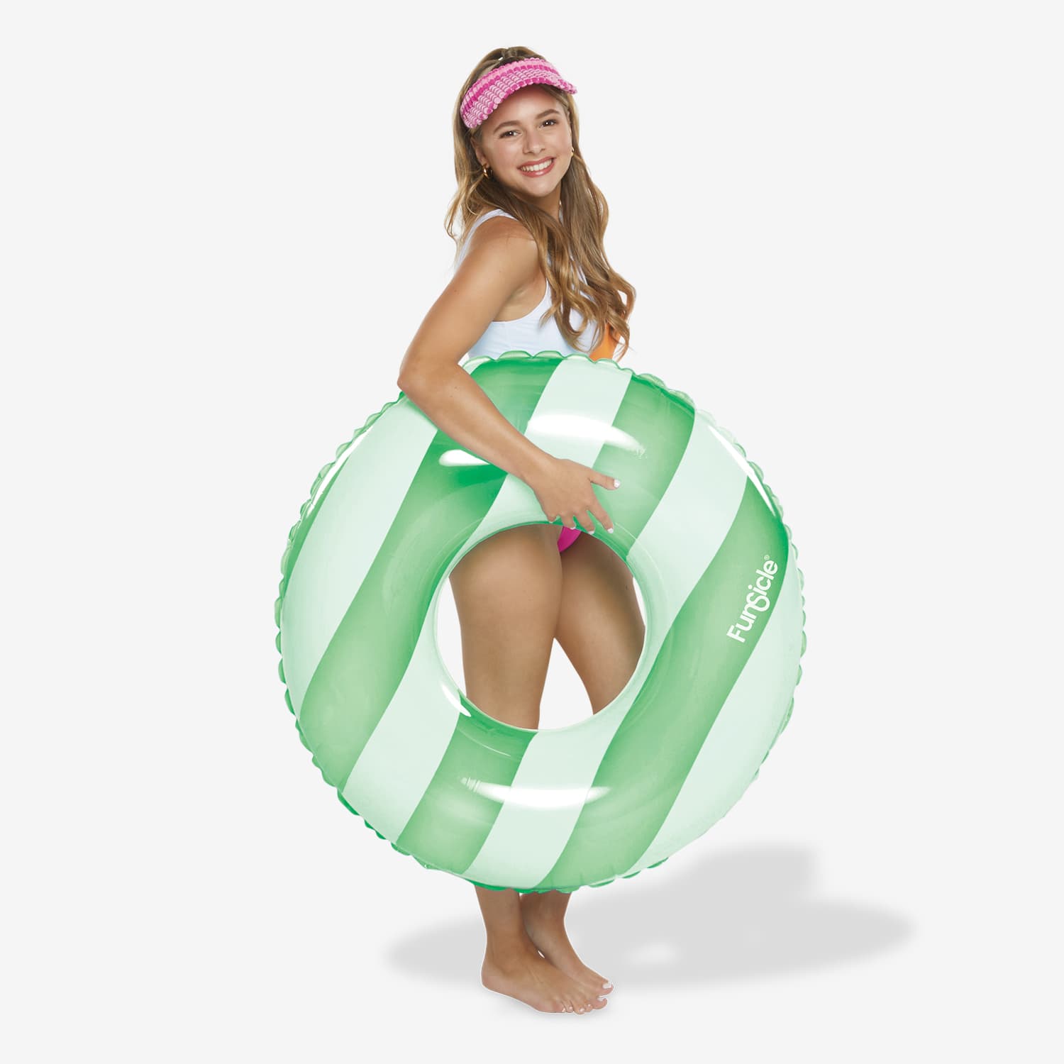 Woman holding a green and white striped inflatable ring on a white background