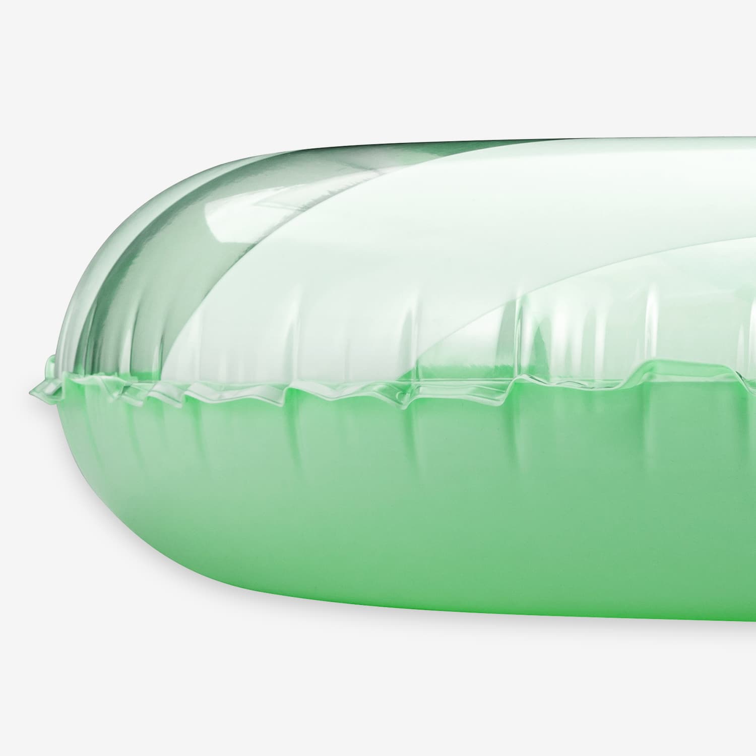 close up side view of Green inflatable pool float on a white background