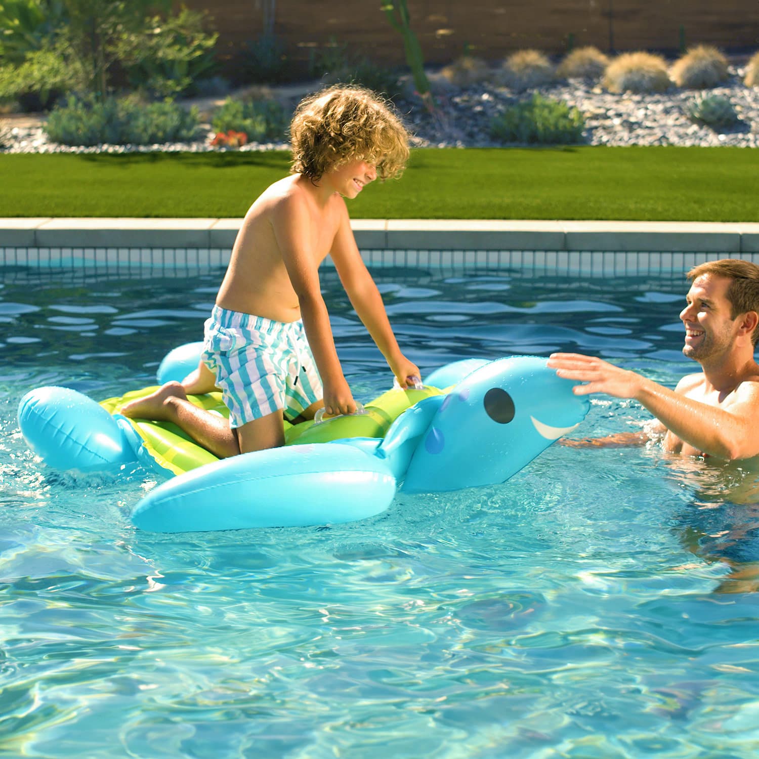 Funsicle Turtle Time Ride-On with models in a pool