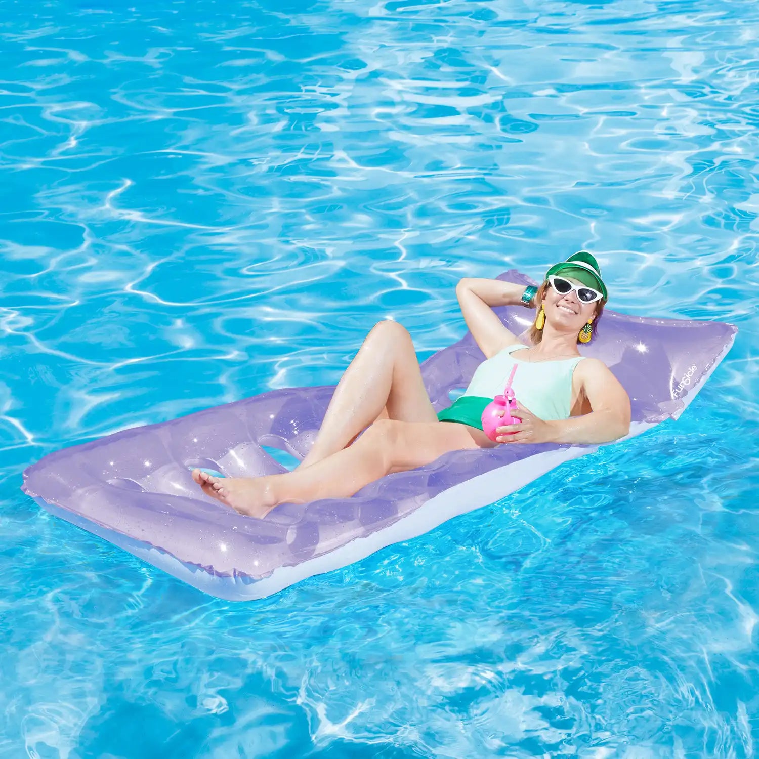 a model lounging on Funsicle Cool Sunbather Mat