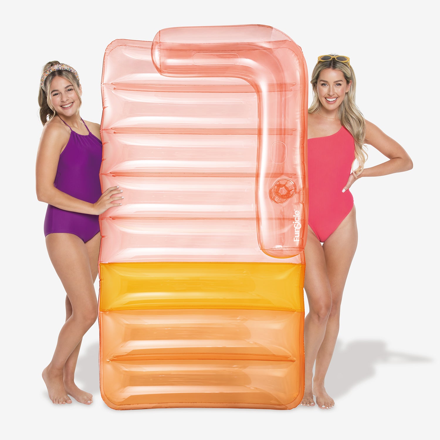 Funsicle Sofa Bed Lounge with two models standing with it on a white background