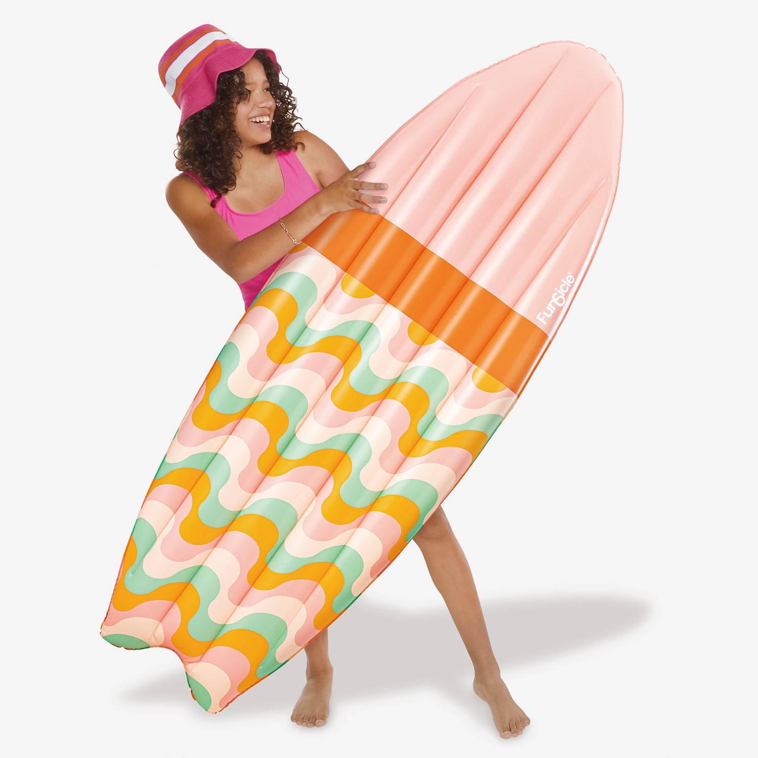 Funsicle Hawaiian Waves Surfboard Float with a model on a white background