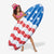 Woman holding an inflatable American flag surfboard float on a white background