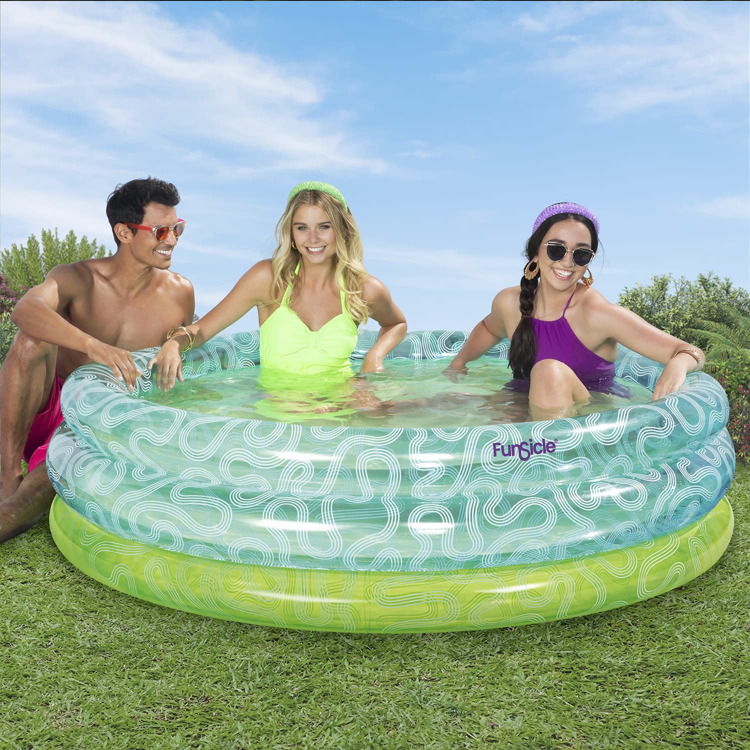 People with Funsicle Squiggle Pool on grass field