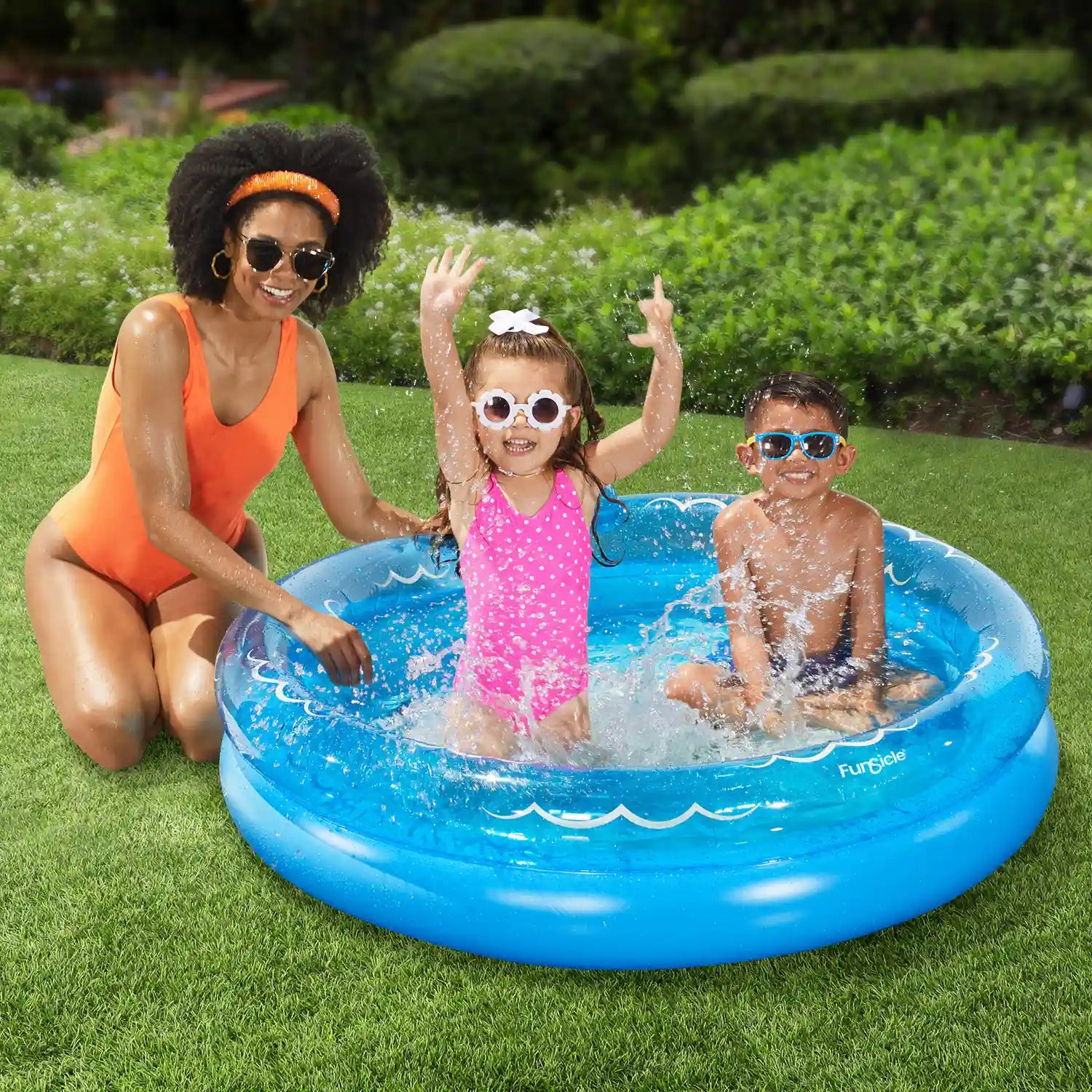 Funsicle Friendly Shark FunRing Pool with models on a grass background