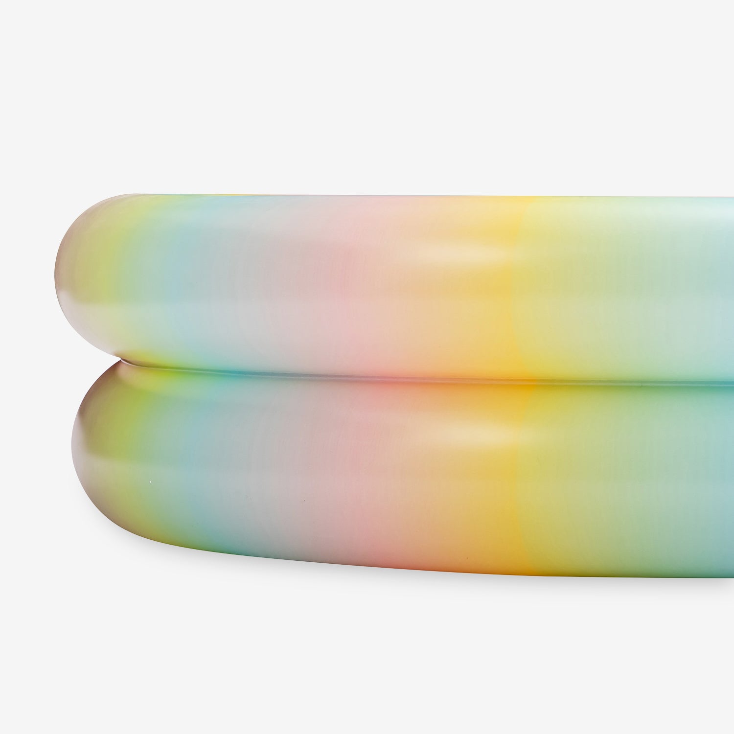 Close up. of inflatable rainbow-colored inflatable pool on a white background