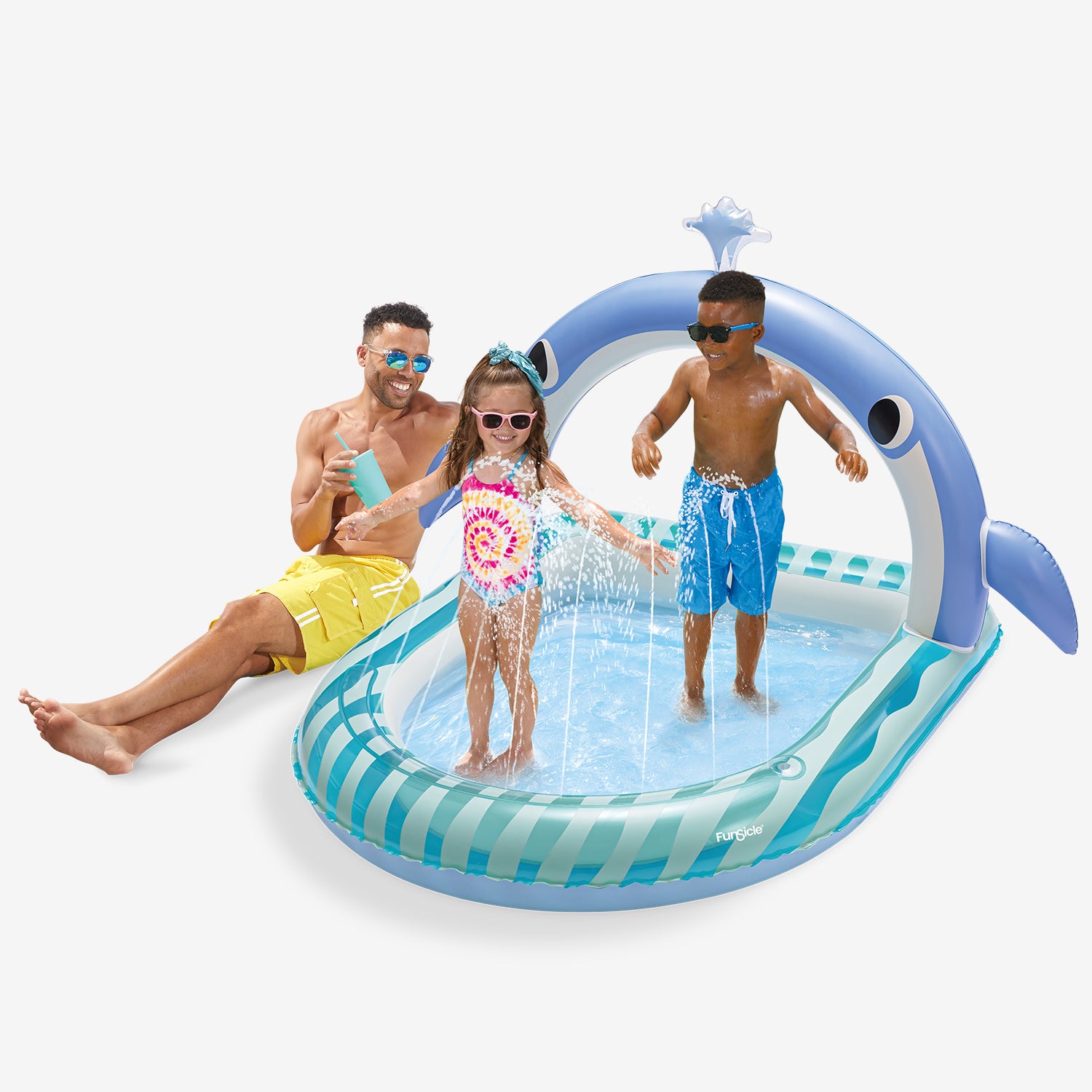 Inflatable pool with a shark design, children playing in it, and a man sitting on the edge.
