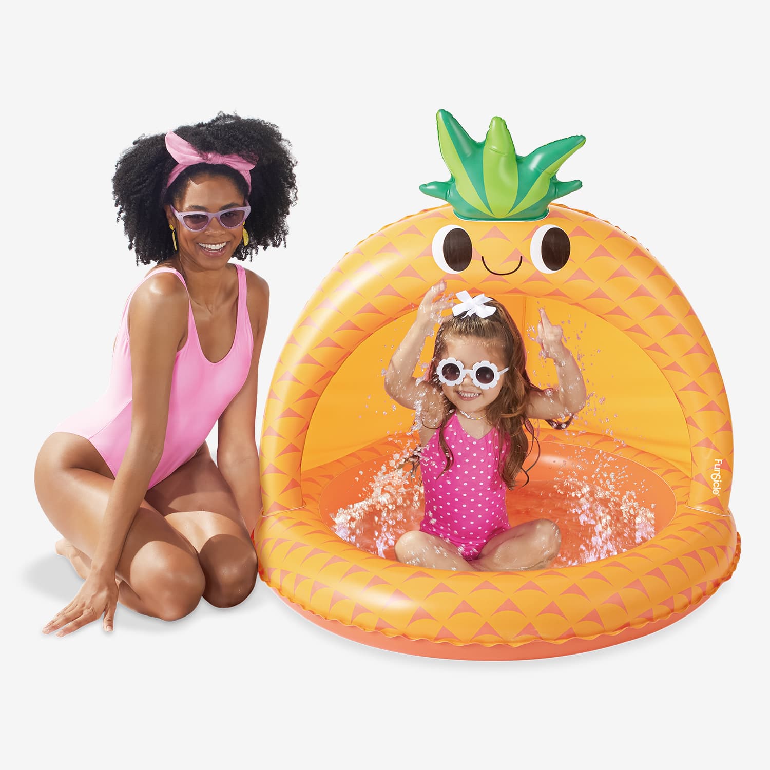 Woman and child in a pineapple shaded inflatable pool