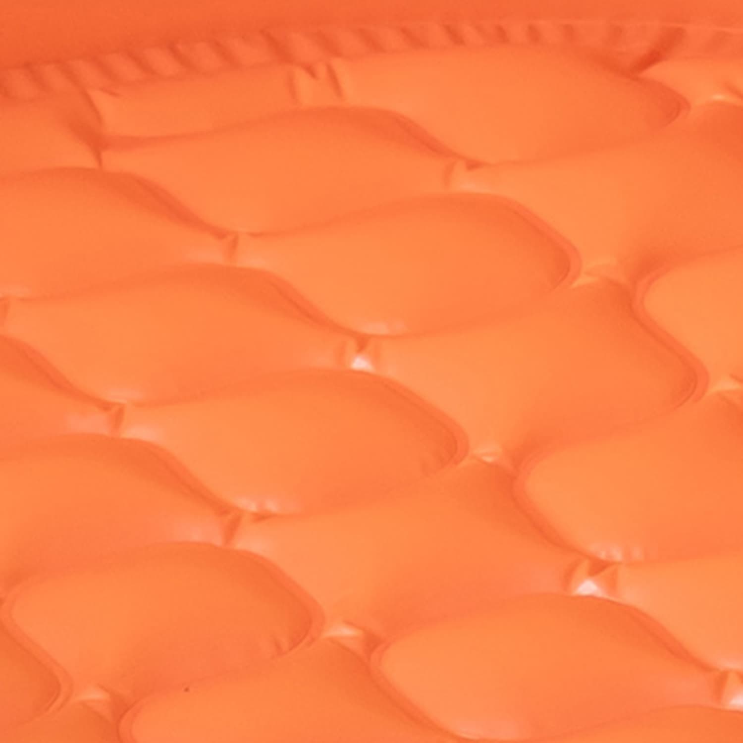 Close-up of an orange inflatable pool with a textured surface.
