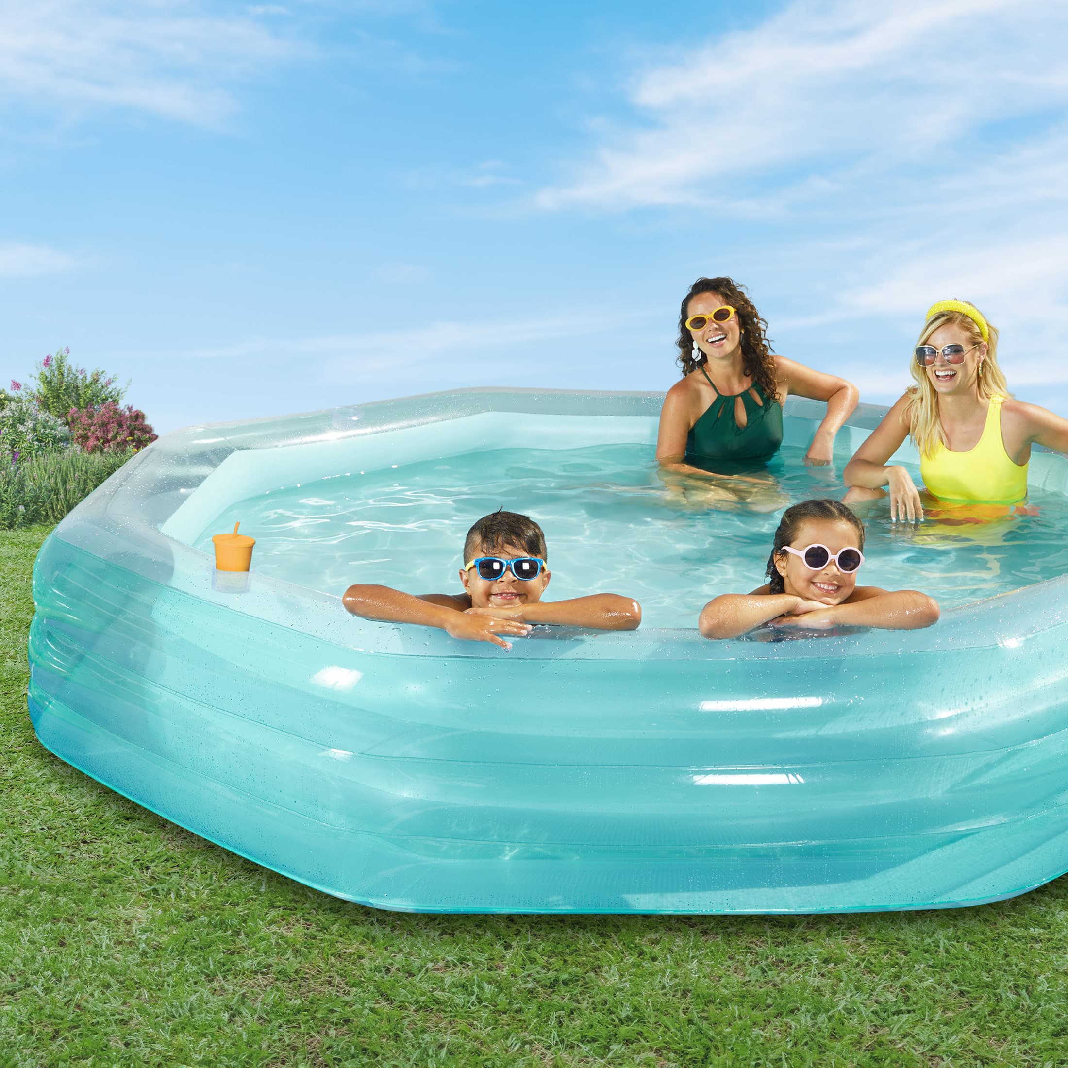 People inside Funsicle OctaClear Pool on a grass background