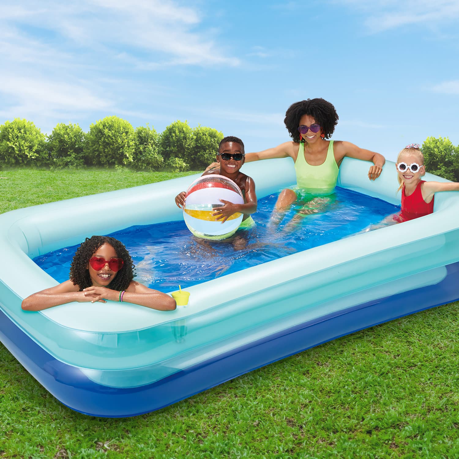 Funsicle SummerBlock Pool with models in a backyard