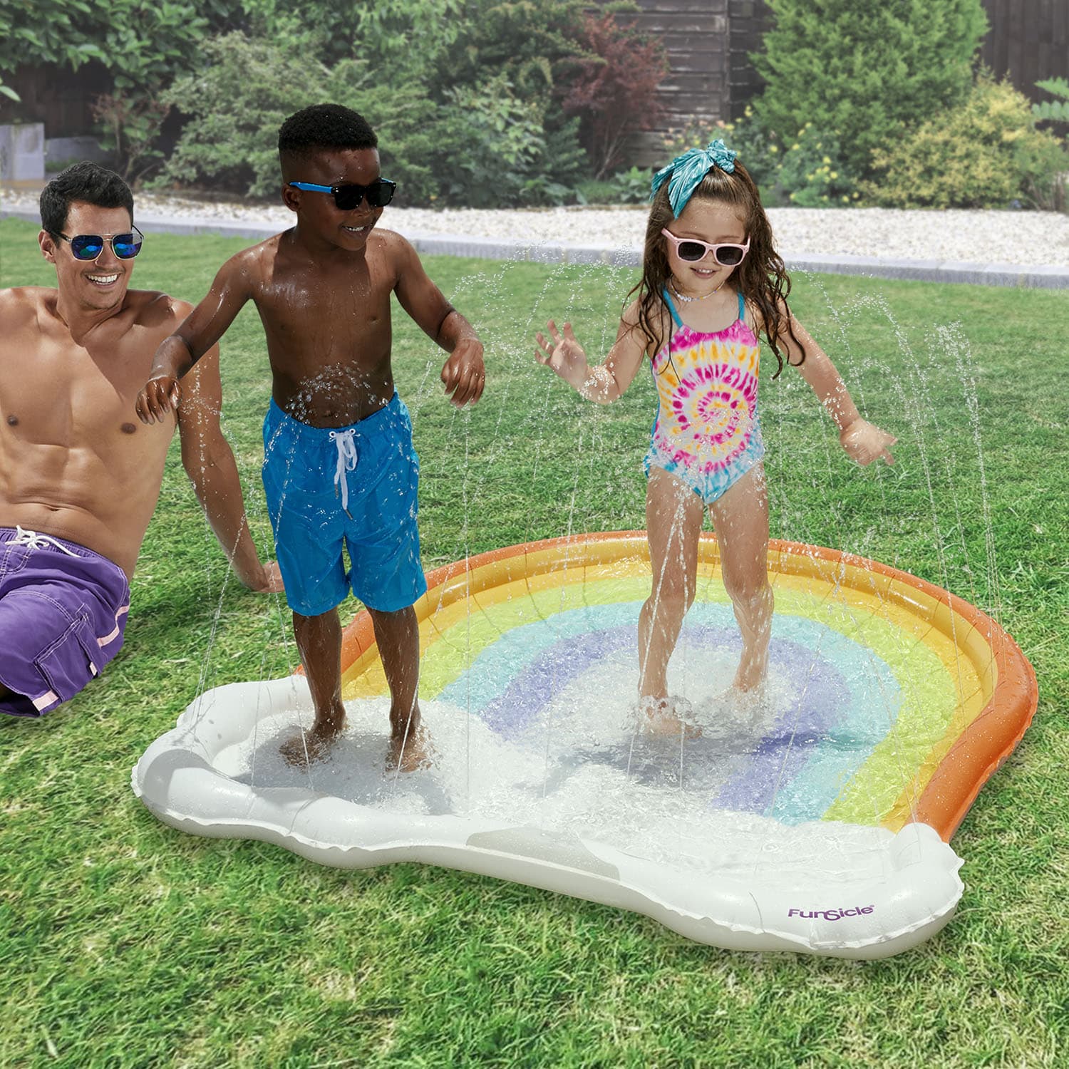 models with Funsicle Rainbow FunSpray Splash Mat in a garden