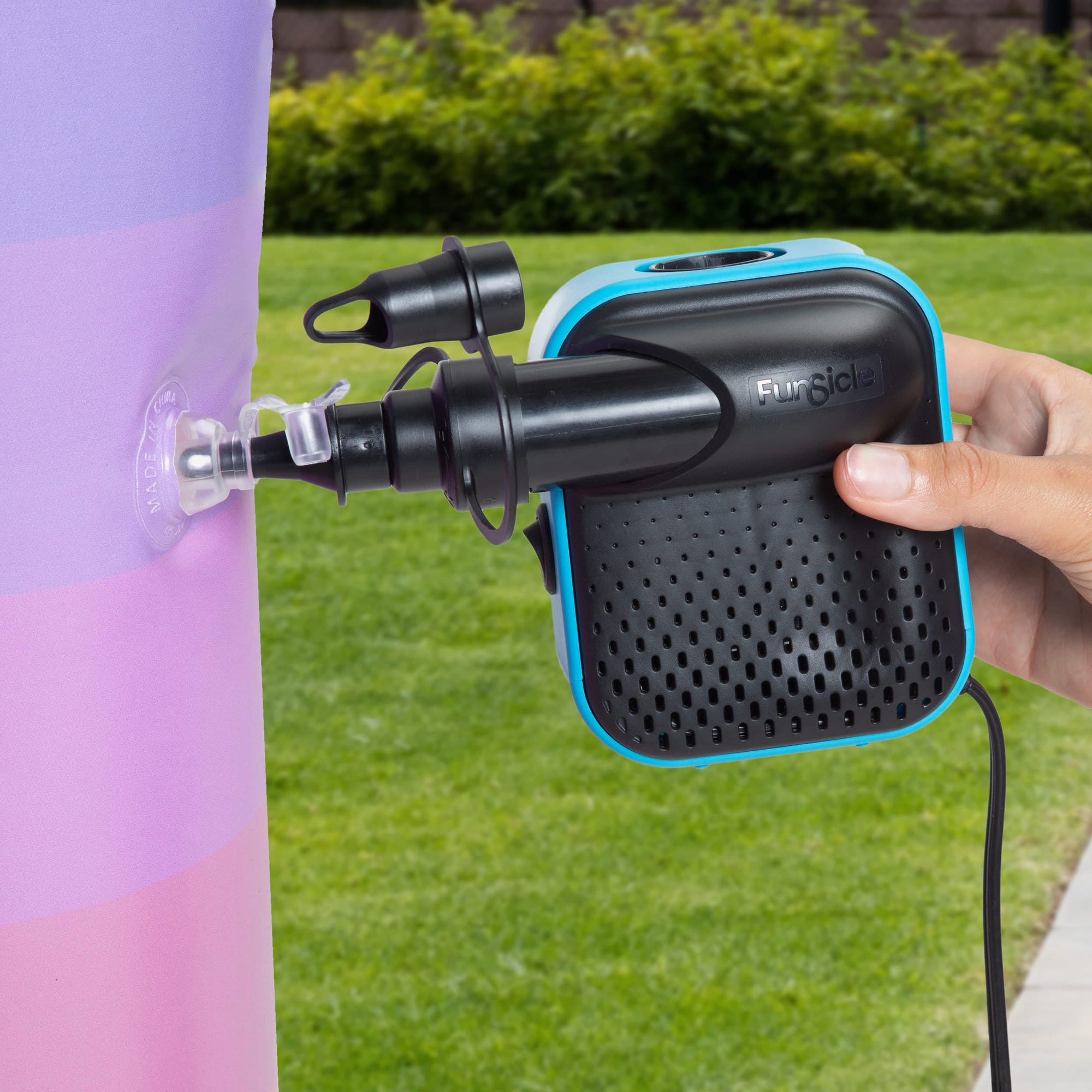 Funsicle PowerPlus Electric Air Pump close up with a model hand holding it