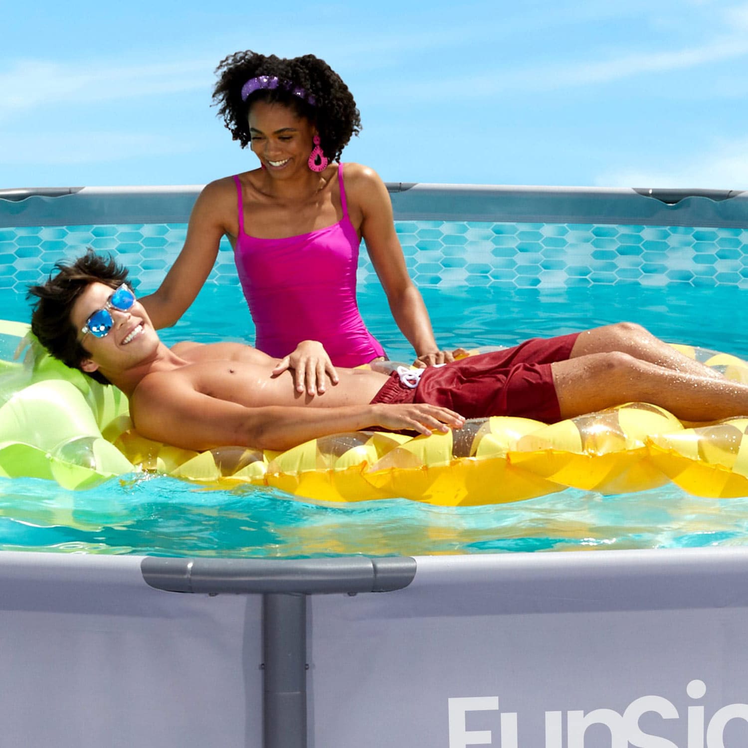 Funsicle 14 ft Oasis Pool with two people close up view