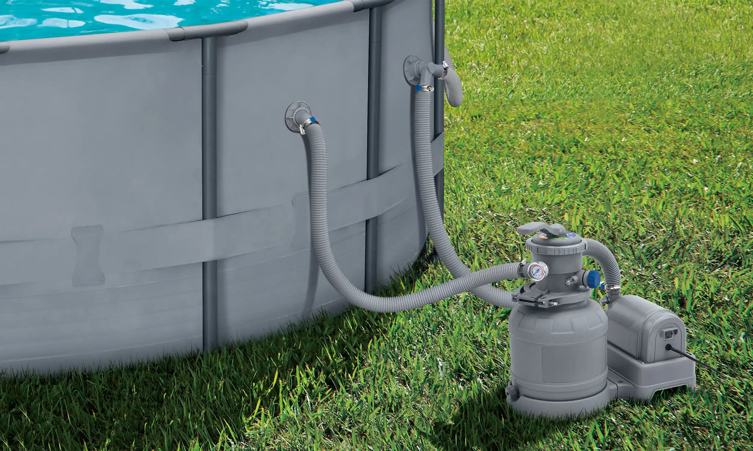 Funsicle 12" Sand Filter Pump attached to a pool on a grass field